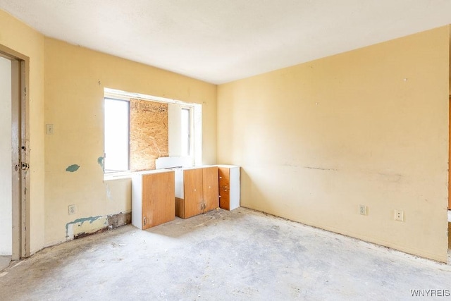 628 9th St, Niagara Falls, NY 14301 - empty room with unfinished concrete flooring