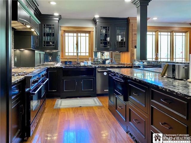 6753 Poverty Hill Rd, Ellicottville, NY 14731 - kitchen featuring black appliances, healthy amount of natural light, light wood finished floors, dark stone counters, and recessed lighting