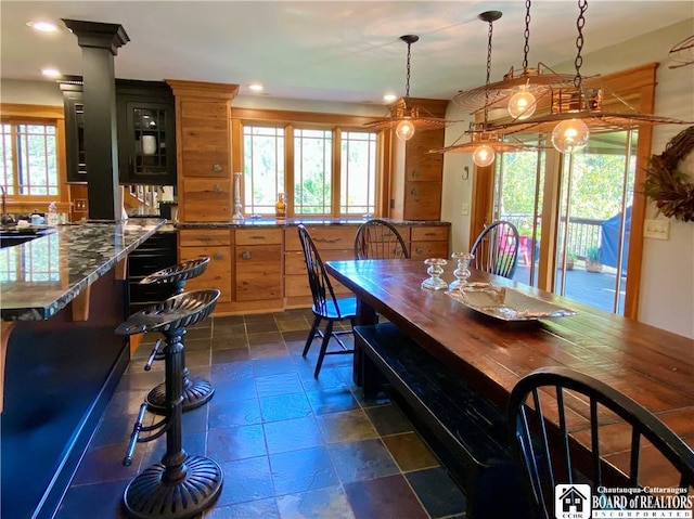 6753 Poverty Hill Rd, Ellicottville, NY 14731 - dining area with plenty of natural light, stone tile floors, and recessed lighting