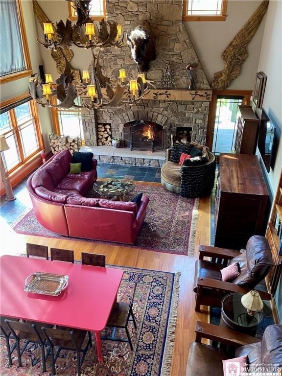 6753 Poverty Hill Rd, Ellicottville, NY 14731 - living area featuring a stone fireplace, wood finished floors, and a high ceiling