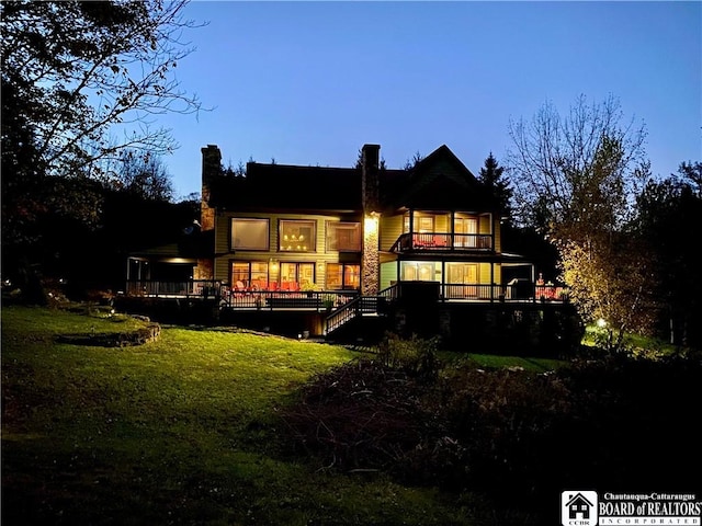 6753 Poverty Hill Rd, Ellicottville, NY 14731 - back of property with a balcony, a yard, a wooden deck, stairway, and a chimney