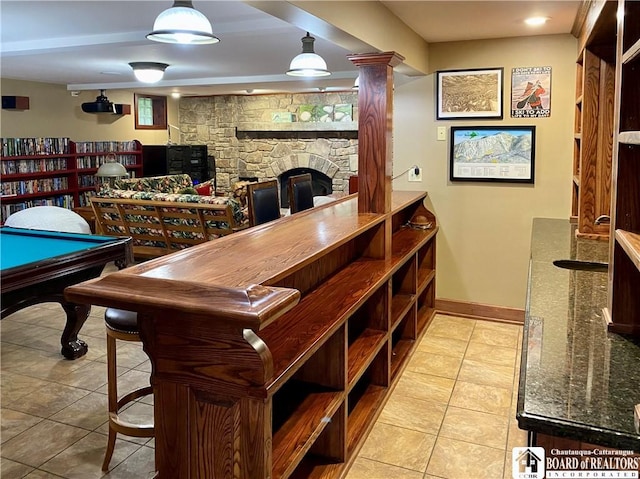 6753 Poverty Hill Rd, Ellicottville, NY 14731 - bar area with a fireplace, tile patterned flooring, and baseboards