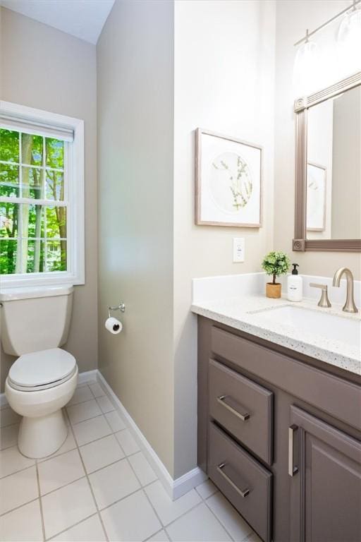 169 Watson Rd, Penfield, NY 14450 - bathroom featuring vanity, toilet, tile patterned floors, and baseboards