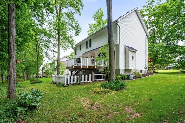 169 Watson Rd, Penfield, NY 14450 - rear view of property with a wooden deck, a lawn, cooling unit, and stairs
