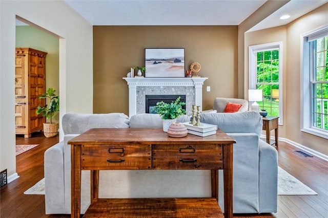 169 Watson Rd, Penfield, NY 14450 - living area featuring plenty of natural light, dark wood-style floors, a high end fireplace, baseboards, and recessed lighting