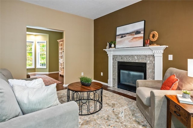 169 Watson Rd, Penfield, NY 14450 - living room featuring wood finished floors, a fireplace, and baseboards