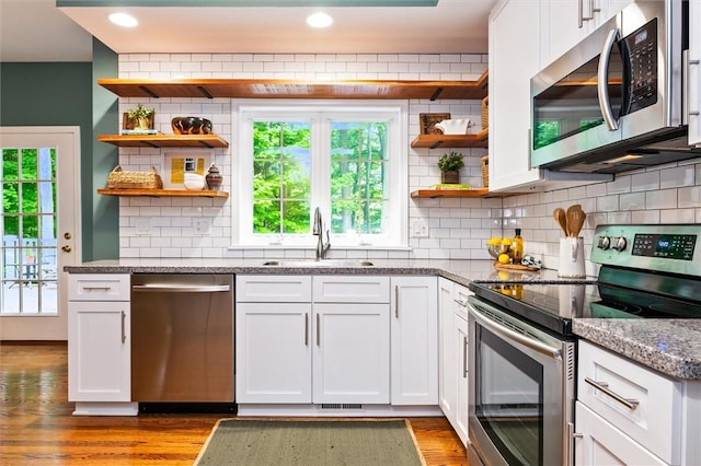 169 Watson Rd, Penfield, NY 14450 - kitchen with appliances with stainless steel finishes, open shelves, a sink, white cabinetry, and recessed lighting