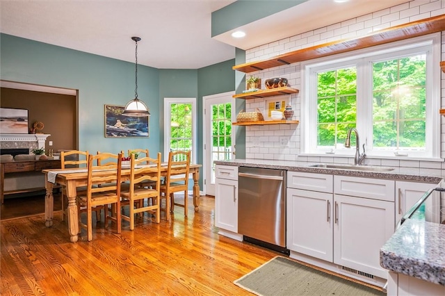169 Watson Rd, Penfield, NY 14450 - kitchen featuring dishwasher, a sink, white cabinetry, light wood finished floors, and recessed lighting