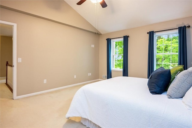 169 Watson Rd, Penfield, NY 14450 - bedroom featuring baseboards, light carpet, vaulted ceiling, and a ceiling fan