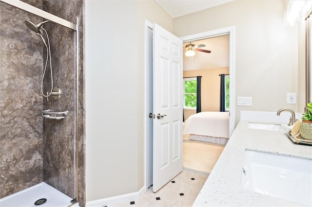 169 Watson Rd, Penfield, NY 14450 - bathroom featuring a stall shower, ensuite bathroom, double vanity, tile patterned flooring, and a ceiling fan