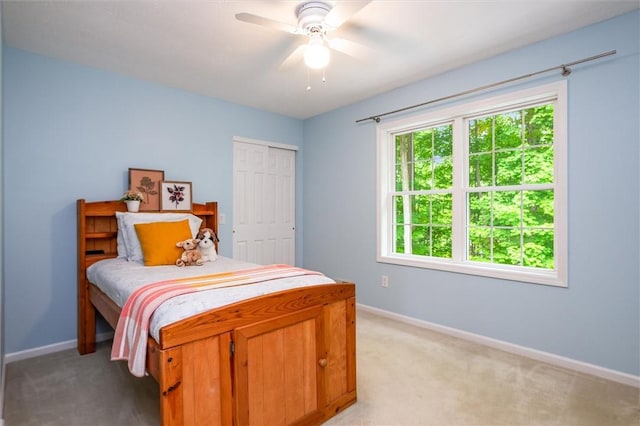169 Watson Rd, Penfield, NY 14450 - bedroom with baseboards, light colored carpet, and a closet