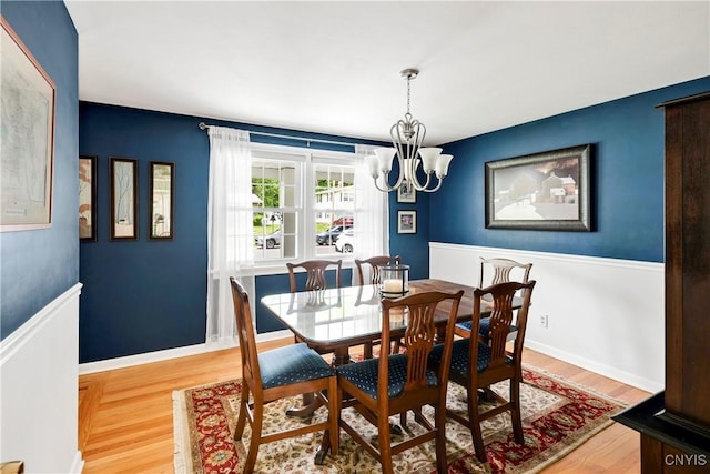 8260 Dexter Pkwy, Lysander, NY 13027 - dining room with wood finished floors and a chandelier