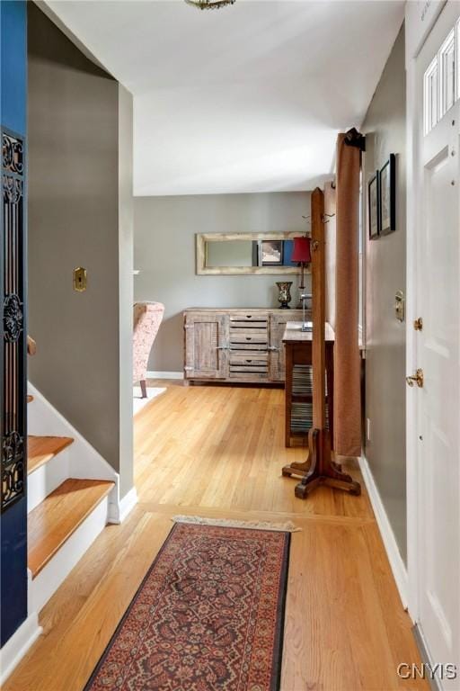8260 Dexter Pkwy, Lysander, NY 13027 - hall with wood finished floors, baseboards, and stairs