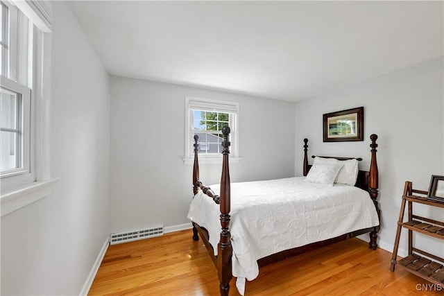 8260 Dexter Pkwy, Lysander, NY 13027 - bedroom featuring light wood finished floors and baseboards