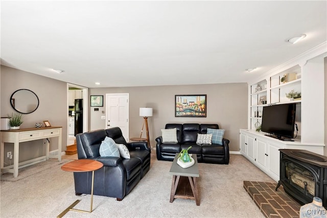 8260 Dexter Pkwy, Lysander, NY 13027 - living room with a wood stove, light carpet, baseboards, and built in features