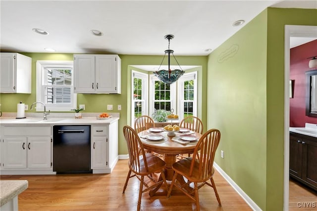 8260 Dexter Pkwy, Lysander, NY 13027 - kitchen featuring black dishwasher, light countertops, and white cabinets
