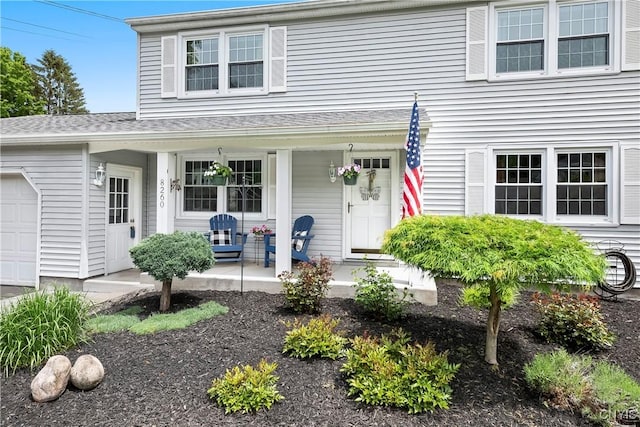 8260 Dexter Pkwy, Lysander, NY 13027 - traditional home featuring covered porch and a garage