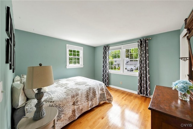 8260 Dexter Pkwy, Lysander, NY 13027 - bedroom featuring light wood-type flooring and baseboards