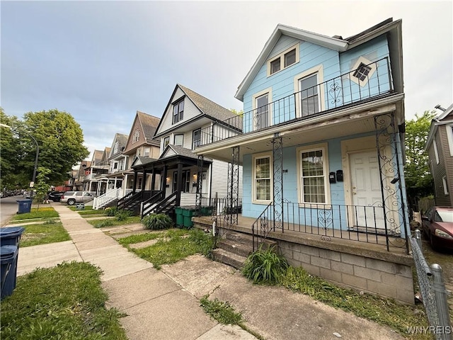 114 19th St, Buffalo, NY 14213 - multi unit property with a porch and a balcony