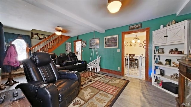 801 W Thomas St, Rome-Inside, NY 13440 - living area with wood finished floors, stairs, beamed ceiling, and a chandelier