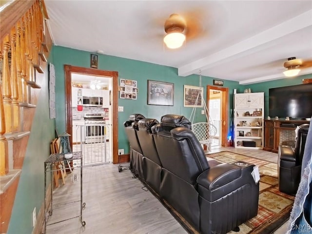 801 W Thomas St, Rome-Inside, NY 13440 - home theater room featuring beam ceiling and wood finished floors