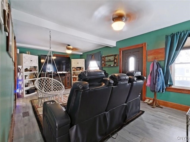 801 W Thomas St, Rome-Inside, NY 13440 - cinema room with plenty of natural light, beam ceiling, wood finished floors, and baseboards