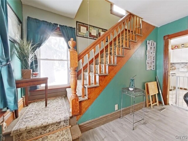 801 W Thomas St, Rome-Inside, NY 13440 - stairs with wood finished floors and baseboards