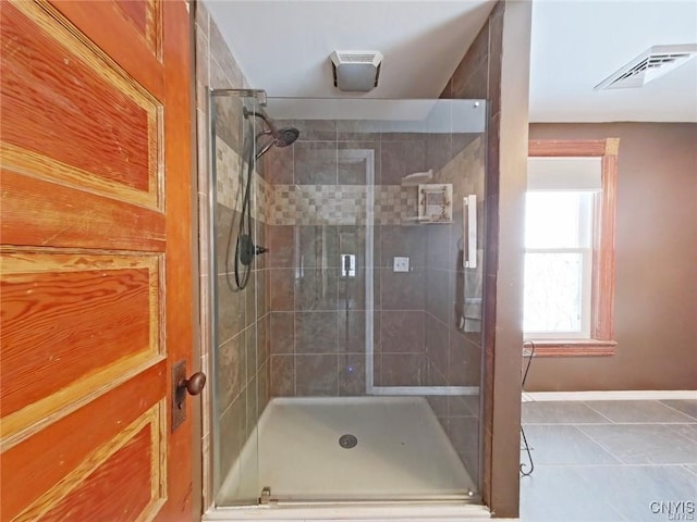 801 W Thomas St, Rome-Inside, NY 13440 - bathroom featuring a shower stall, baseboards, and tile patterned floors