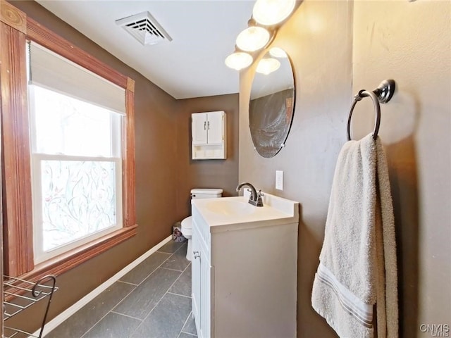 801 W Thomas St, Rome-Inside, NY 13440 - half bath featuring vanity, toilet, baseboards, and tile patterned flooring