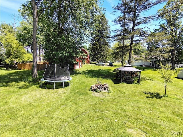 801 W Thomas St, Rome-Inside, NY 13440 - view of yard featuring a gazebo, a trampoline, and a fire pit