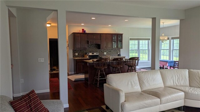 12 Probst Rd, Mendon, NY 14534 - living area featuring dark wood finished floors, recessed lighting, and a chandelier