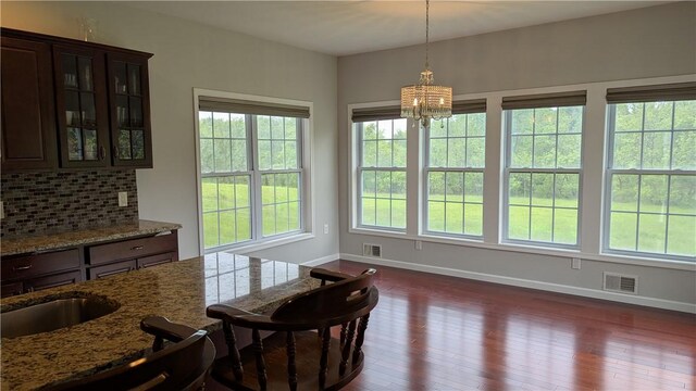 12 Probst Rd, Mendon, NY 14534 - dining area featuring a chandelier and dark wood-type flooring