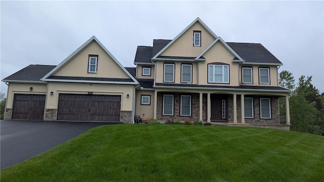 12 Probst Rd, Mendon, NY 14534 - view of front facade featuring stucco siding, a front yard, covered porch, stone siding, and driveway