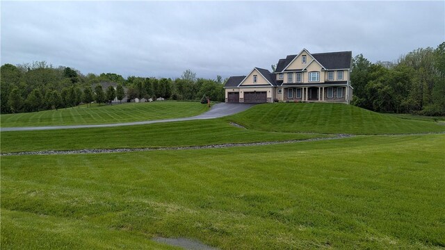 12 Probst Rd, Mendon, NY 14534 - view of front of property featuring a front yard, an attached garage, and driveway