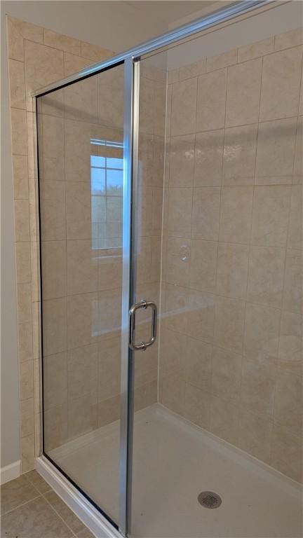 12 Probst Rd, Mendon, NY 14534 - bathroom with a stall shower and tile patterned flooring