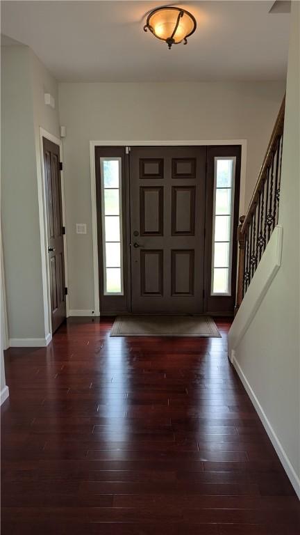 12 Probst Rd, Mendon, NY 14534 - foyer featuring wood finished floors, healthy amount of natural light, and stairway