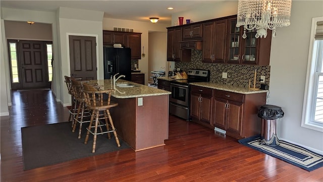 12 Probst Rd, Mendon, NY 14534 - kitchen with electric range, black fridge with ice dispenser, a chandelier, dark wood-type flooring, and decorative backsplash