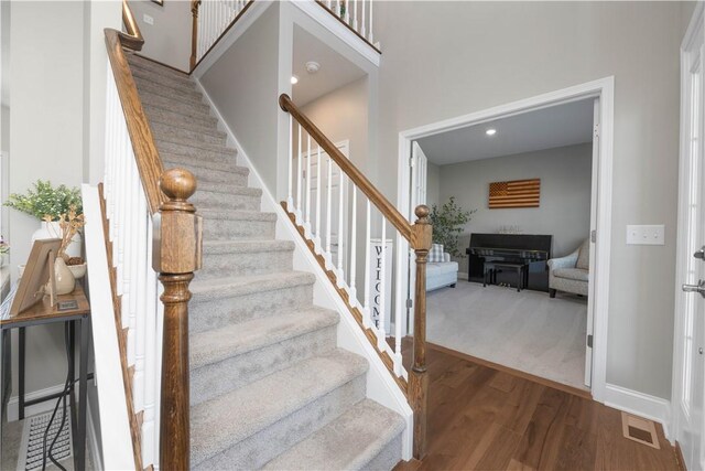 8 Giovanni Ln, Parma, NY 14468 - stairway featuring wood finished floors, baseboards, and recessed lighting