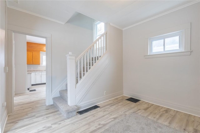 7 Herbert St, Rochester, NY 14621 - stairs with ornamental molding, wood finished floors, plenty of natural light, and baseboards