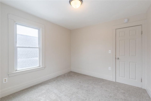 7 Herbert St, Rochester, NY 14621 - carpeted empty room featuring healthy amount of natural light, a smoke detector, and baseboards