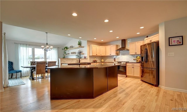 4580 Carlyes Ct, Hamburg, NY 14075 - kitchen featuring stainless steel appliances, wall chimney exhaust hood, dark countertops, tasteful backsplash, and a chandelier