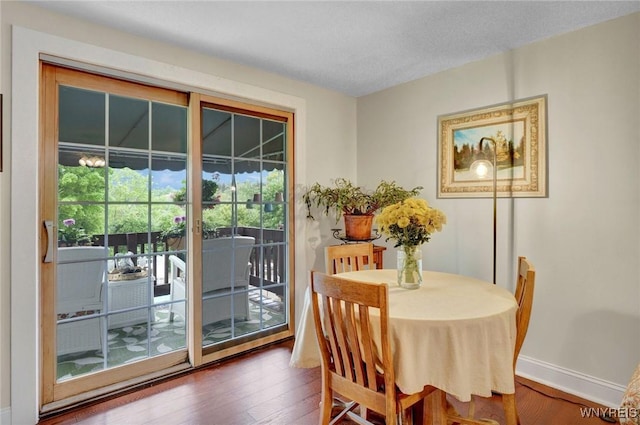 270 Buffalo Rd Unit 72, Aurora, NY 14052 - dining area with wood finished floors and baseboards
