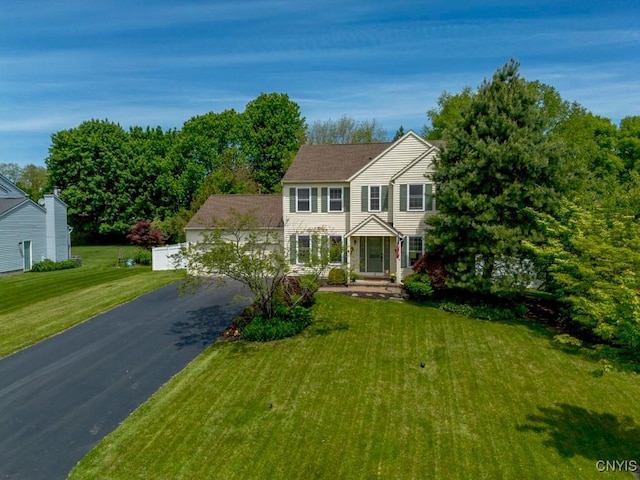 3 Foxwood Dr, Lysander, NY 13027 - view of front facade featuring driveway, a front lawn, and a garage