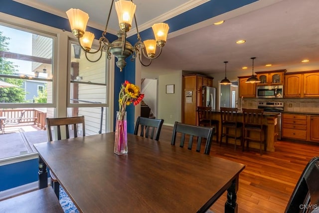 3 Foxwood Dr, Lysander, NY 13027 - dining area featuring a chandelier, ornamental molding, dark wood-type flooring, baseboards, and recessed lighting