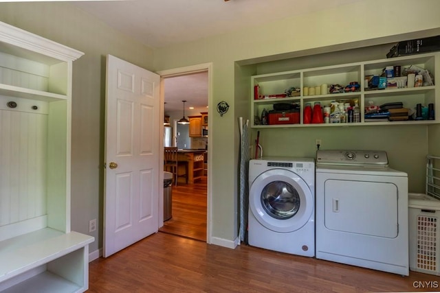 3 Foxwood Dr, Lysander, NY 13027 - laundry area featuring washing machine and dryer, wood finished floors, and baseboards