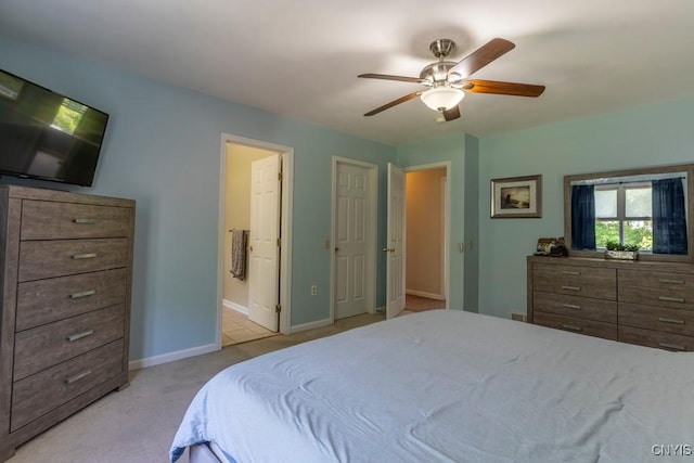 3 Foxwood Dr, Lysander, NY 13027 - bedroom featuring light colored carpet, baseboards, ensuite bath, and a ceiling fan