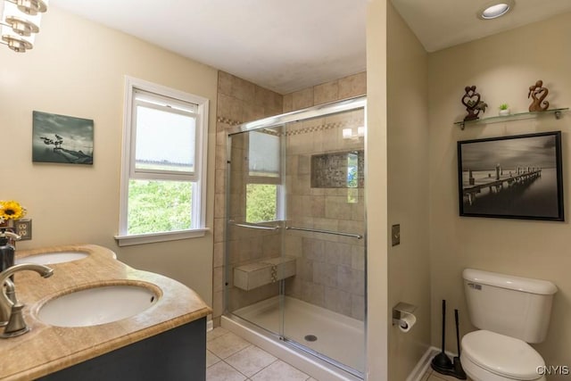 3 Foxwood Dr, Lysander, NY 13027 - full bath with tile patterned floors, toilet, a shower stall, baseboards, and double vanity