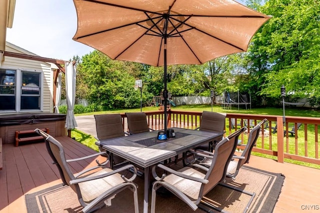 3 Foxwood Dr, Lysander, NY 13027 - wooden deck featuring a trampoline, a hot tub, and outdoor dining area