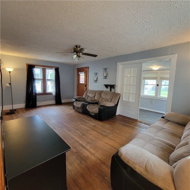 133 California Dr, Greece, NY 14616 - living room featuring a textured ceiling, wood finished floors, ceiling fan, and baseboards