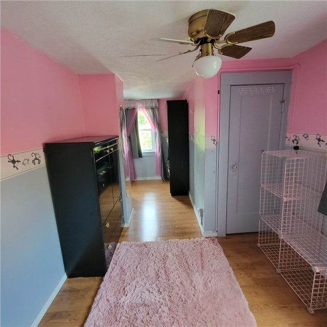 133 California Dr, Greece, NY 14616 - kitchen with ceiling fan, light wood-style flooring, baseboards, and a textured ceiling